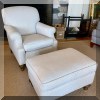 F06. Club chair and matching ottoman with geometric patterned upholstery. 